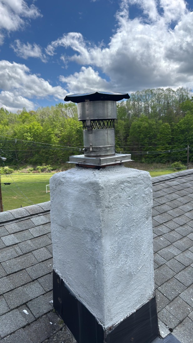 Same chimney with a new parge coat and cap