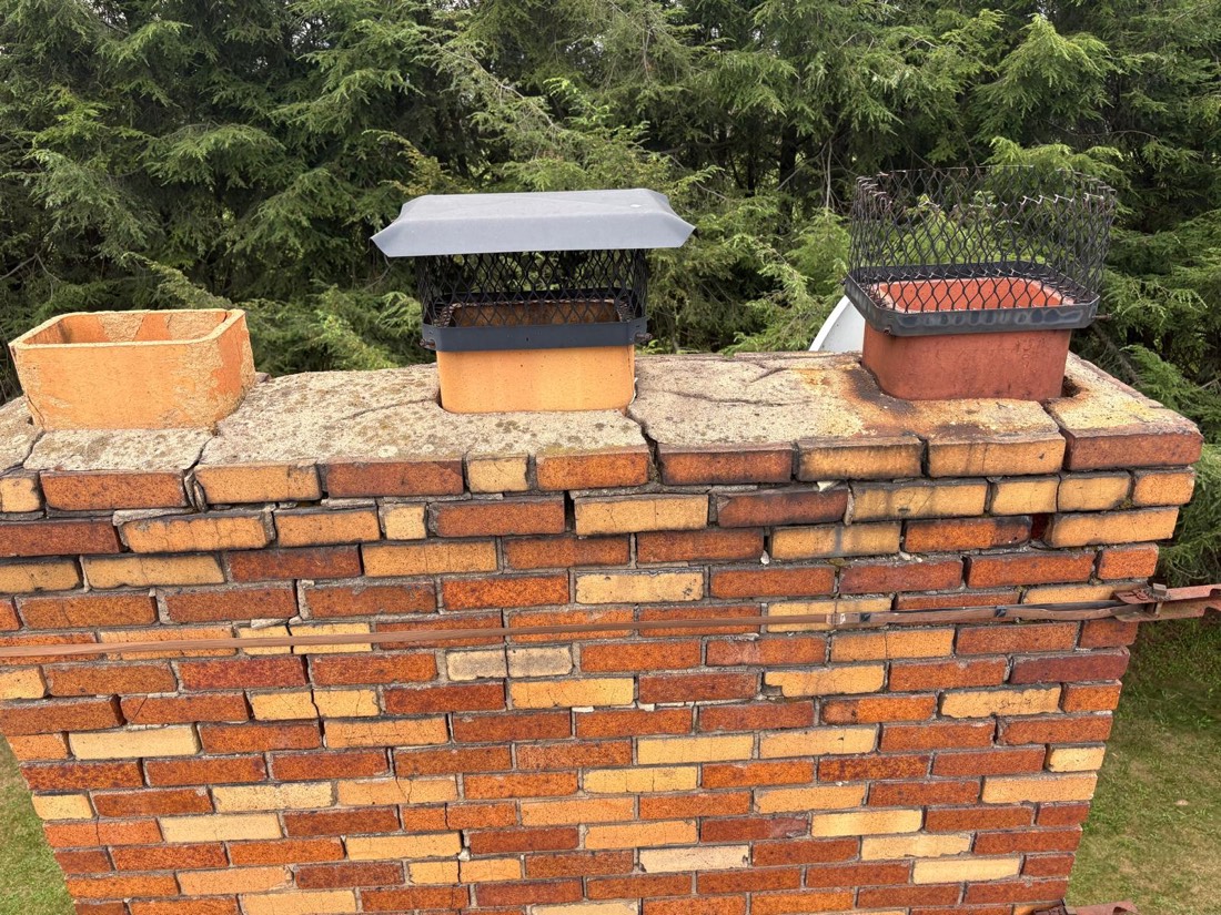 Cracked chimney crown and failing mortar joints
